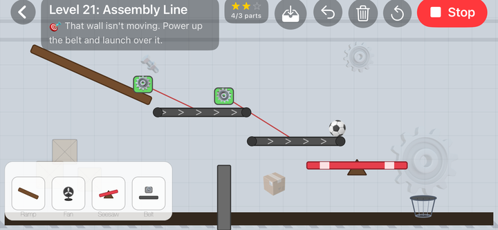 Level 21, Assembly Line: a ramp feeding two powered conveyor belts, with a football on the lower belt, a seesaw and a wall between it and the basket on the factory floor.