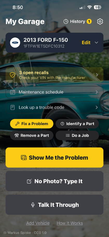 My Garage, showing a saved 2013 Ford F-150 with three open recalls, and buttons for diagnosing a problem by photo, by typing, or by voice.