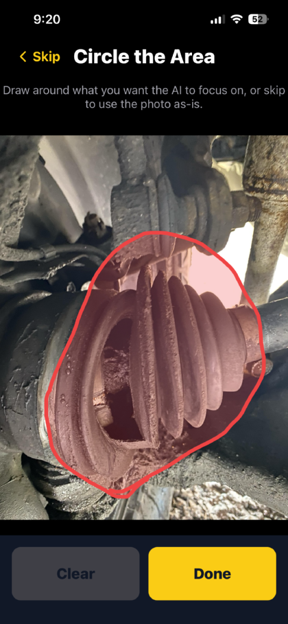 The Circle the Area screen: a photo of a torn CV boot under the truck, with a red circle drawn around the split rubber to tell the app what to look at.